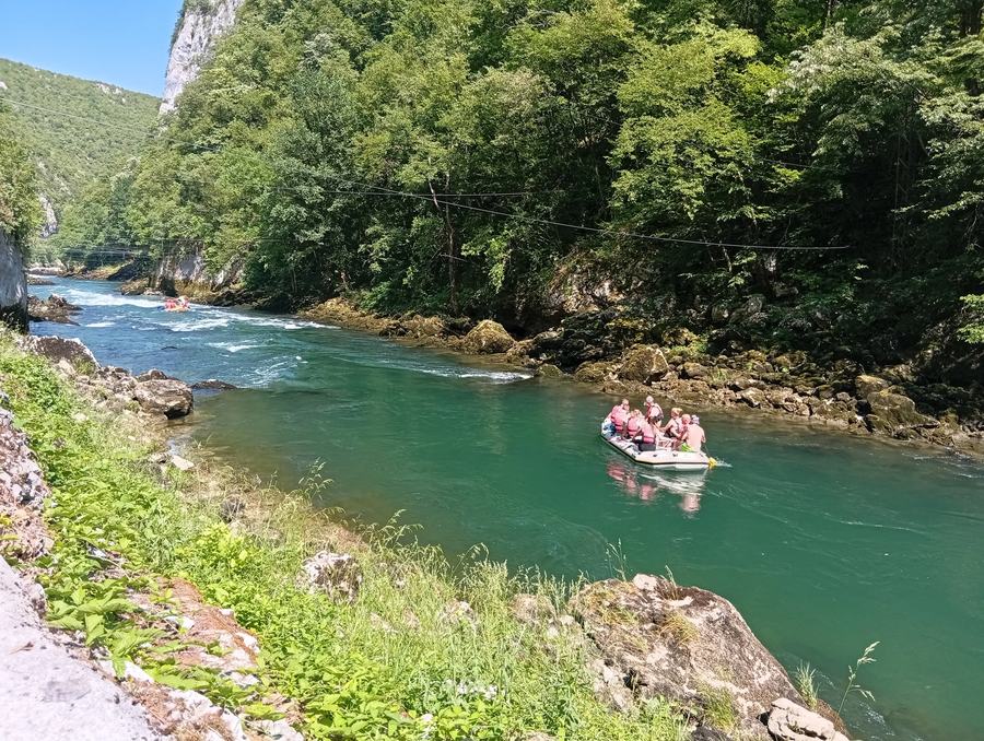 Tall limestone cliffs of the Tijesno canyon above the green Vrbas river