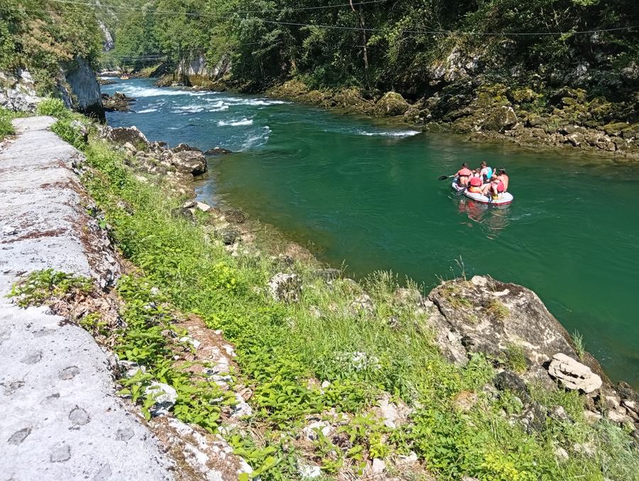 Two rafting boats following the line through the rapids on the Vrbas