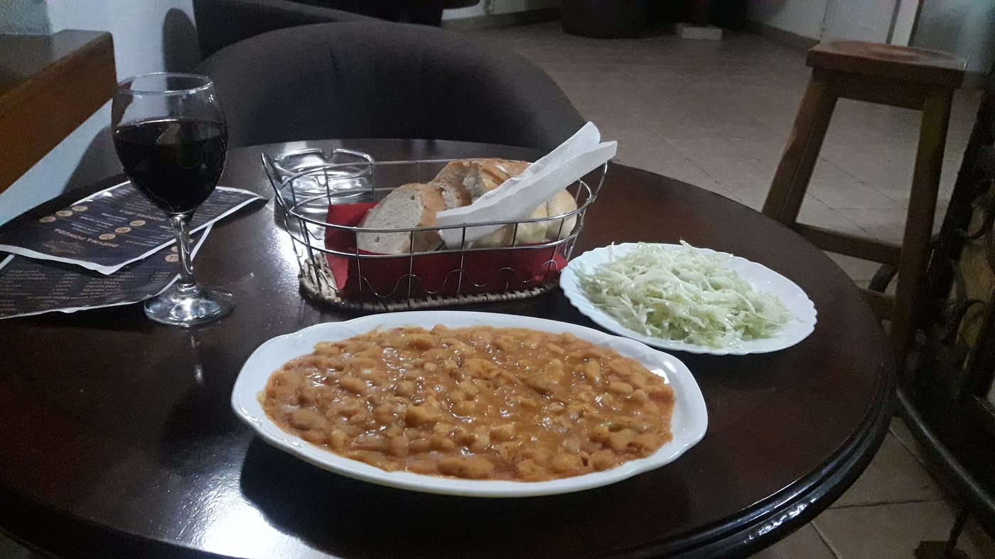 Traditional local meal &mdash; beans, bread, slaw and a glass of red wine